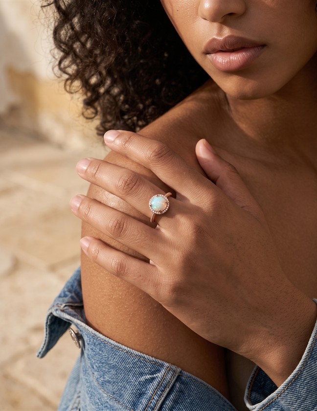 Model wearing an opal ring