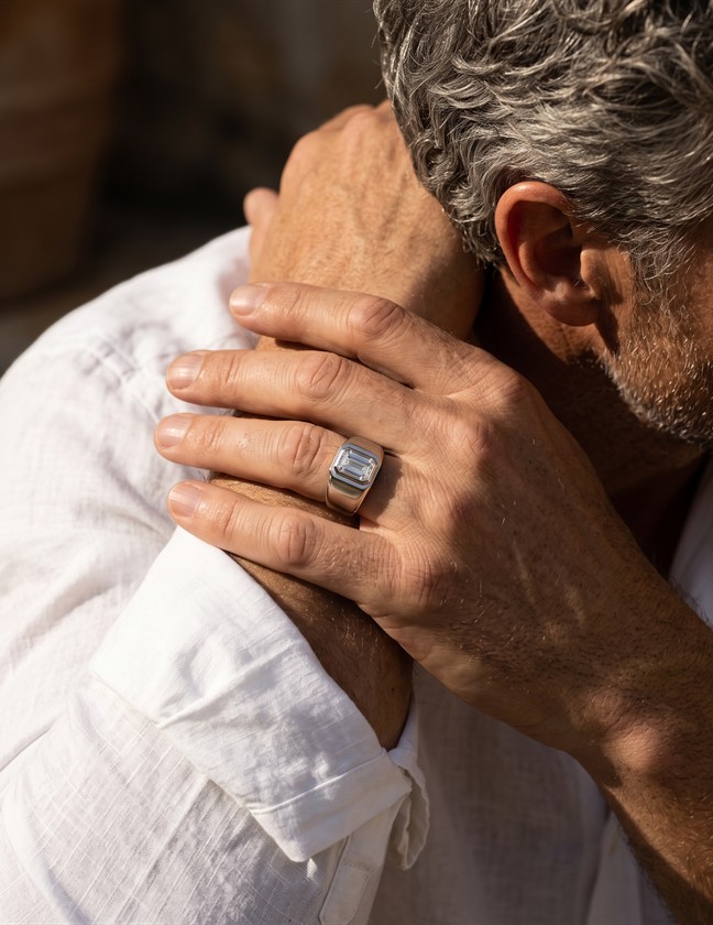 Model wearing a square signet ring