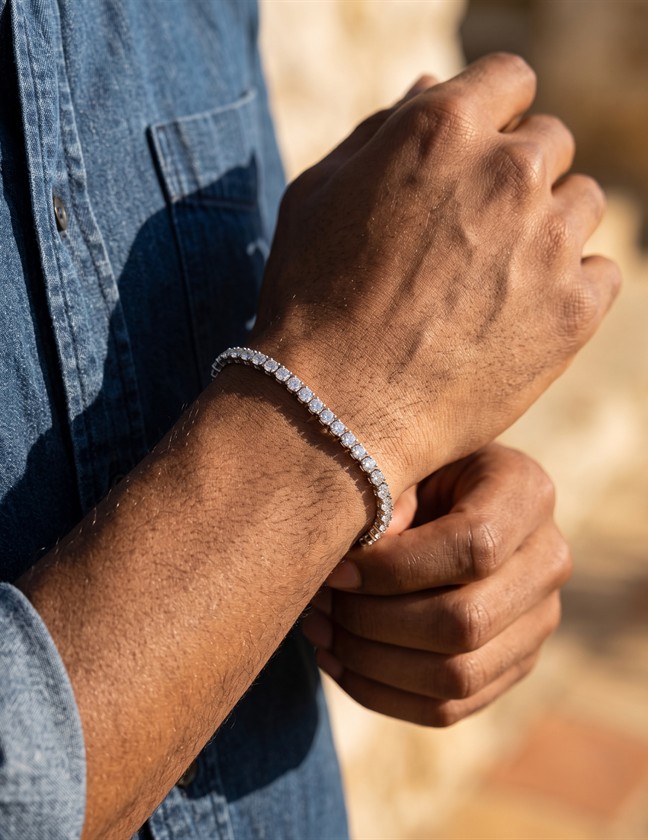 Close crop of a model wearing a tennis bracelet